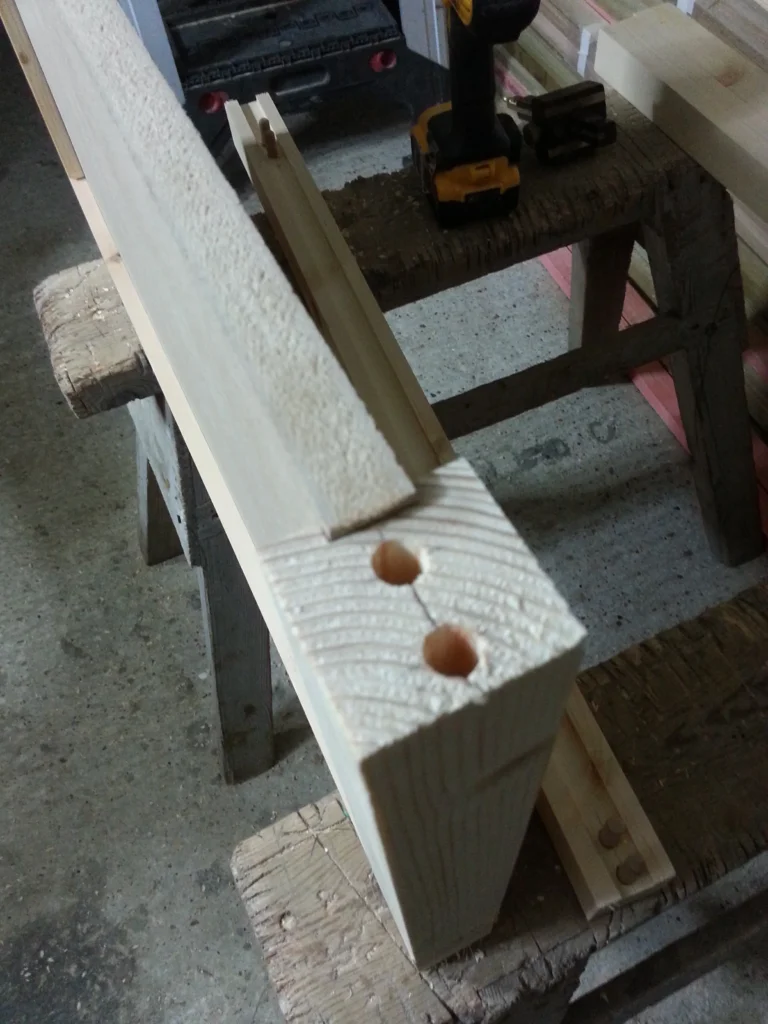 Detail shot of a structural timber joint featuring twin dowel holes for a strong, hidden mechanical fixing.